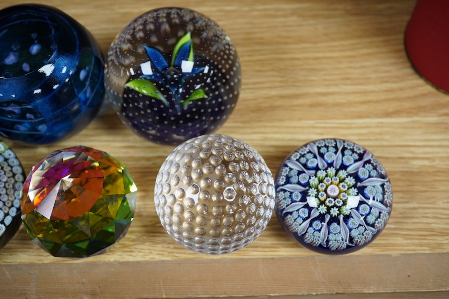 A group of paperweights to include Waterford, Caithness and Edinburgh, largest 8cm in diameter. Condition - fair to good